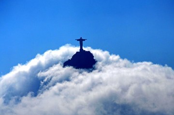Jesus in the sky - View from the sugar loaf to the Corcovado mountain with the "Christ the Redeemer" statue. Both two well known sights of Rio de Janeiro, Brazil.
